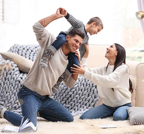 Happy family enjoying time together in a fresh and clean room