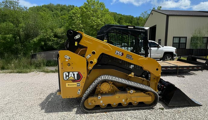 New skid steer outside a building New skid steer outside a building